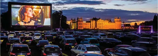  ??  ?? CARS AND STARS: Film fans park up at stately home Blenheim Palace for a drive-in showing of Pretty Woman on the big screen