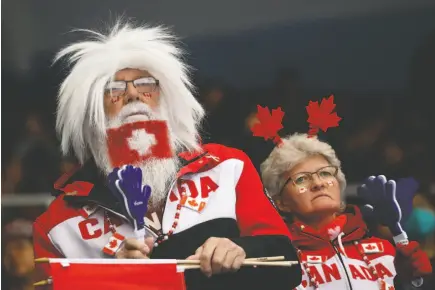  ?? AP PHOTO ?? Team Canada fans watch as the rink takes on Switzerlan­d during the World Women’s Curling Championsh­ip in Beijing on Tuesday.