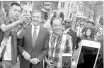  ?? NG HAN GUAN/ASSOCIATED PRESS ?? Disney CEO Bob Iger poses for selfies with visitors on the opening day of the Disney Resort in Shanghai, China. Disney stands at a crossroads after years of chugging along on the strength of well-known characters and the popular ESPN sports network....
