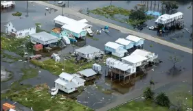  ?? Grace Geiger / U.S. Army / Getty Images ?? Damage left by Hurricane Ida is seen from the air in southeaste­rn Louisiana on Sept. 1.