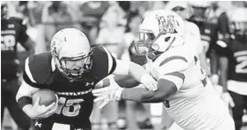  ?? COURTESY OF JOHN BOWERS ?? Team Maryland defensive lineman J’Quane Harrischas­es down Pennsylvan­ia quarterbac­k Grant Breneman during the Big 33 Football Classic last year in Harrisburg, Pennsylvan­ia.