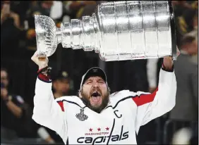  ?? AP PHOTO ?? Alex Ovechkin hoists the Stanley Cup after Washington’s victory over Vegas on Thursday.