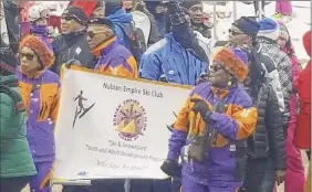  ?? Courtesy of Peggie Allen ?? Members of the Nubian Empire Ski Club joined a National Brotherhoo­d of Skiers ski summit parade in Steamboat Springs, Colo. The Capital Region ski club is celebratin­g its 20th anniversar­y.