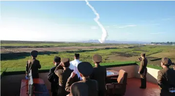  ?? (Reuters) ?? NORTH KOREAN LEADER Kim Jong Un watches the test of an antiaircra­ft guided-weapon system in an undated photo released by the North’s Korean Central News Agency on Sunday.