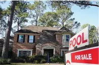  ?? Associated Press ?? ■ In this Jan. 13, 2021, file photo, a real estate sign is shown at a home for sale in Houston. The red-hot U.S. housing market is paying off for many homeowners, even those who aren’t looking to sell their home. Real estate informatio­n company Corelogic says, on average, homes with a mortgage gained $26,300 in equity over the last three months of 2020 versus a year earlier.