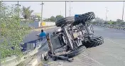  ?? HT PHOTO ?? The tractor-trailer that overturned after being hit by a truck on the Amritsar-Bathinda national highway near Tarn Taran.