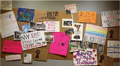  ?? Photo courtesy TRAHC ?? ■ A collection of protest signs is part of “We Cannot Just Be Quiet,” a new exhibit at the Regional Arts Center. The exhibit includes various forms of art and artifacts inspired by recent protests.