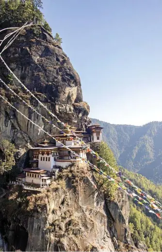  ?? Photo: iStock ?? ONLY WAY IS UP: Bhutan’s famous Tiger's Nest temple is a high point for many visitors.