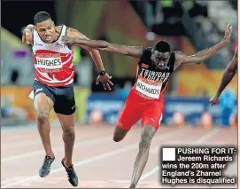  ??  ?? PUSHING FOR IT: Jereem Richards wins the 200m after England’s Zharnel Hughes is disqualifi­ed