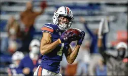  ?? BUTCH DILL/ ASSOCIATED PRESS ?? Auburn wide receiver Anthony Schwartz’s draft projection­s to date have been in the third- to fifth- round range, but with his 40- yard dash time — an unofficial 4.26 seconds — he could go earlier than expected.