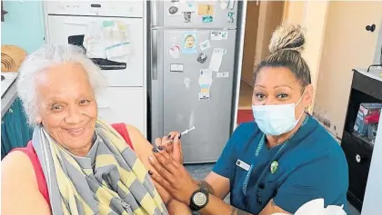  ?? Photo / Supplied ?? Berrys Health Centre Pharmacy nurse Desiree Paul vaccinatin­g Kuia Mateohorer­e Kanuta at her home in Foxton because she has no access to transport to get out to a clinic.