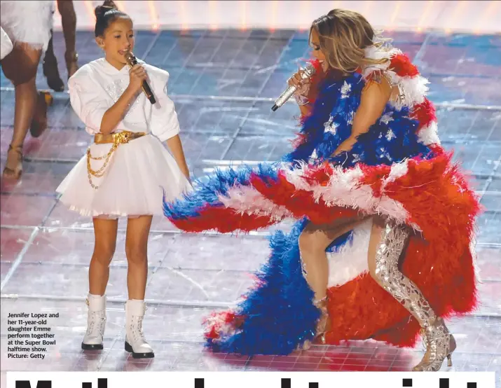  ??  ?? Jennifer Lopez and her 11-year-old daughter Emme perform together at the Super Bowl halftime show. Picture: Getty