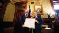  ??  ?? PAUL PACKER, US Commission for the Preservati­on of America’s Heritage Abroad chairman (right), gives Albanian Prime Minister Edi Rama an award at the White House on Monday.