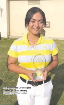  ??  ?? Annyka Pineda Cayabyab pose with the girl’s Class B trophy.