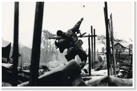  ?? PHOTOS: DON MCCULLIN/CONTACT PRESS IMAGES ?? U.S. Marine throwing grenade, Tet Offensive, Hué, South Vietnam, February 1968, gelatin silver print.