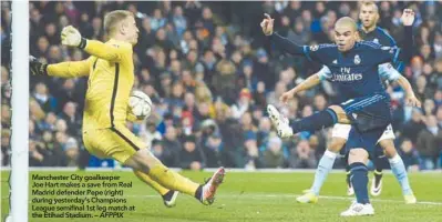  ??  ?? Manchester City goalkeeper Joe Hart makes a save from Real Madrid defender Pepe (right) during yesterday’s Champions League semifinal 1st leg match at the Etihad Stadium. – AFPPIX