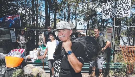  ?? Picture: GLENN HAMPSON ?? Volunteer Methven Sparks with rubbish collected from areas next to Black Swan Lake during Clean Up Australia Day yesterday.