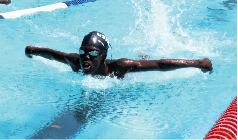  ??  ?? uShaka Swimming Club’s Thabiso Vilakazi finishes strongly in the boy’s 50m butterfly event, clocking 42.72