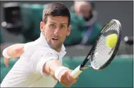  ?? Kirsty Wiggleswor­th / Associated Press ?? Novak Djokovic plays a return to Matteo Berrettini during the men’s singles final at Wimbledon in July.