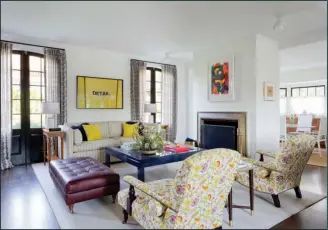  ?? Amy Bartlam/AP ?? Floral prints: This photo provided by Amy Sklar Design shows two chairs in a room with floral prints. “As a designer, I love bold floral prints that feel modern but wink to the classics,” says designer Sklar. “The profile of this particular chair is...