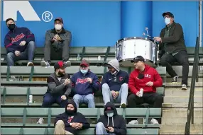  ?? TONY DEJAK — THE ASSOCIATED PRESS ?? Black Keys drummer and life-long Indians fan Patrick Carney pounds on the drum in the first inning of a baseball game between the Kansas City Royals and the Cleveland Indians, April 5 in Cleveland.