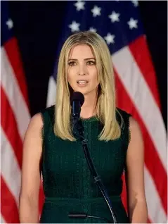  ??  ?? BELOW: Ivanka introduces her father at an event during his presidenti­al campaign in 2016. BOTTOM: “Dear Ivanka” protesters outside her apartment in New York.