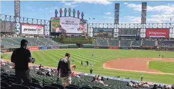  ?? AP FILES ?? Fans arrive for a game between the White Sox and Kansas City Royals in May at Guaranteed Rate Field.