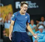  ?? David Moir / Associated Press ?? Alex de Minaur of Australia reacts to his win over Andreas Seppi of Italy in the men’s final match at the Sydney Internatio­nal on Saturday.