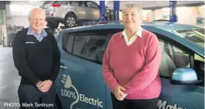  ??  ?? Richard Pither of Porirua Motors and customer Carole Hicks are impressed by electric vehicle technology.