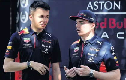  ??  ?? Red Bull drivers Alexander Albon, left, and Max Verstappen chat in their paddock in Melbourne last month.