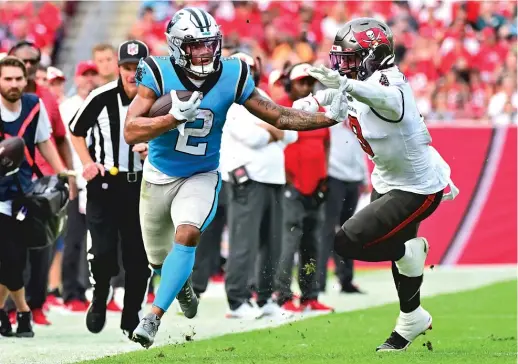  ?? JULIO AGUILAR/GETTY IMAGES ?? As part of the trade package agreed to Friday, wide receiver D.J. Moore is headed to Chicago, where he’ll be a sorely needed target for Justin Fields.