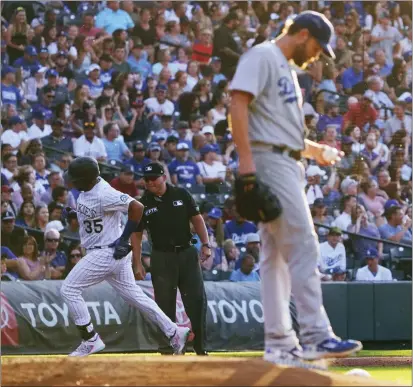  ?? JACK DEMPSEY – THE ASSOCIATED PRESS ?? The Rockies' Elias Diaz (35) rounds the bases after hitting a solo home run off Dodgers starting pitcher Clayton Kershaw in the third inning.