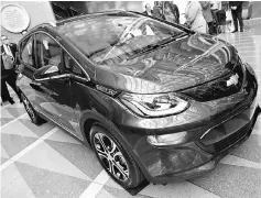  ??  ?? The 2017 Chevrolet Bolt EV is on display during The Economic Club event in Washington, DC. General Motors chief executive Mary Barra said the Detroit automaker is exploring opportunit­ies with French automaker PSA Group, but declined to discuss a...