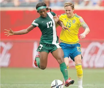  ??  ?? Francisca Ordega of Nigeria and Therese Sjogran of Sweden challenge for the ball during the FIFA Women's World Cup 2015 Group D match which ended 3-3