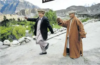  ?? Picture: Getty Images ?? Locals Haider Kahn, 92, and Mohammed Gulman, 97, practise a traditiona­l dance in Passu, Upper Hunza Valley, Pakistan.