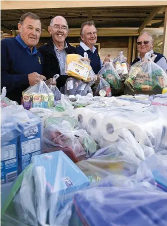  ?? PHOTO: KEVIN ?? SUPPORTERS: City Golf Club members (from left) Danny Carroll, Col Muller, Ash Mundey and Ken Mills donate a ute load of non-perishable items to St Luke’s Parish Pantry.
FARMER