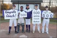  ?? COURTESY PERKIOMEN SCHOOL ATHLETICS ?? Perkiomen School baseball coach Ken Baker, center, poses with his players after winning his 500th game against Quakertown on Friday.