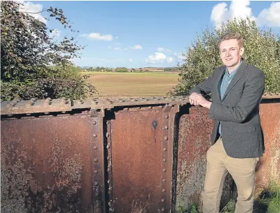  ?? Picture: Steve MacDougall. ?? Councillor Calum Purves at a former railway bridge in Mawcarse where the train line used to run through, and he hopes to reinstate it.