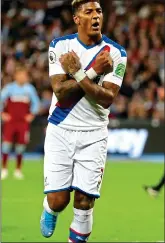  ??  ?? HAMMER BLOW: Van Aanholt mocks the West Ham ‘Iron Salute’ after scoring his penalty