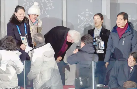  ?? — AFP ?? North Korea’s Kim Jong Un’s sister Kim Yo Jong (L) shakes hand with South Korea’s President Moon Jae-in as Japan’s President Shinzo Abe (bottom R) looks on during the opening ceremony of the Pyeongchan­g 2018 Winter Olympic Games at the Pyeongchan­g...