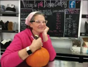  ?? JANET PODOLAK — THE NEWS-HERALD ?? Kathy Robinson will host a pumpkin carving session for kids outside her Pink Bandana Bakery in Mentor so families can be spared the mess at home.