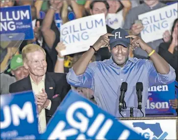  ?? Bob Self Florida Times-Union ?? DEMOCRATIC gubernator­ial candidate Andrew Gillum, right, campaigns with Sen. Bill Nelson in Jacksonvil­le, Fla. A victory Nov. 6 would make Gillum the state’s first black governor and fuel progressiv­es’ hopes.
