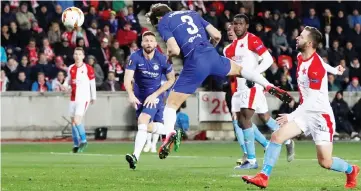  ?? — Reuters photo ?? Chelsea’s Marcos Alonso scores their first goal during the UEFA Europa League quarter-final, first leg match against Slavia Prague in Prague.