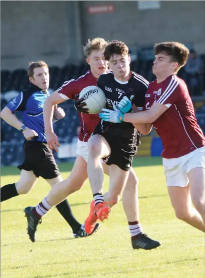  ??  ?? Sligo’s Ronan Wilson tries to get by two Galway defenders during the Connacht Minor Championsh­ip in Markievicz Park.
