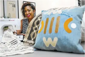  ?? PHOTO BY MEL EVANS/AP FILE ?? Terina McKinney works with Malian mud cloth for her fashion accessorie­s and home decor items in Camden, N.J. When McKinney shows her works at luncheons and other events, black women express interest, but they don’t often buy.