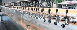  ??  ?? There’s 40 taps, extending the full length of the area behind the bar at the Beer Spot on Auckland’s North Shore.