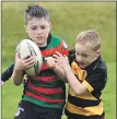  ?? ?? Youngsters tussle for the ball in a match between Oban Lorne and Lochaber.