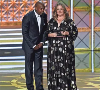  ?? PHOTOS BY ROBERT HANASHIRO, USA TODAY ?? Dave Chappelle didn’t rehearse his presentati­on with Melissa McCarthy. So they ad-libbed their way to the nominees for best director for a comedy series.