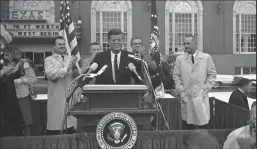  ?? UTA SPECIAL COLLECTION­S/STAR-TELEGRAM FILE PHOTOGRAPH ?? President John F. Kennedy speaks to a crowd in front of Hotel Texas, Fort Worth. Vice President Lyndon B. Johnson to JFK’s left and Texas Governor John Connally over JFK’s left shoulder, Senator Ralph Yarborough over right shoulder, and State Senator...