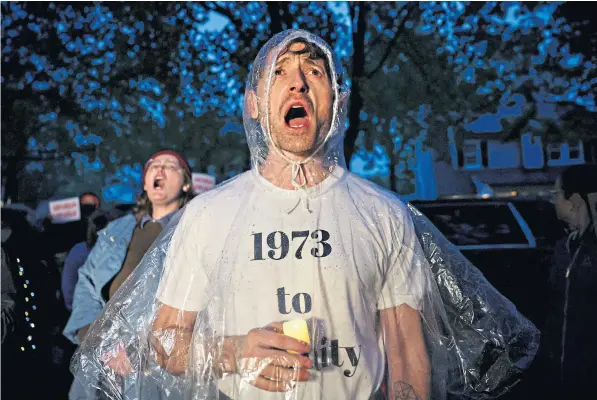  ?? ?? Pro-choice campaigner­s outside the home of Supreme Court Justice Brett Kavanaugh in Chevy Chase at the weekend. As many as 23 states are expected to outlaw abortion if the draft ruling is confirmed in the summer